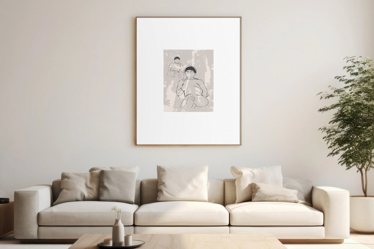 A minimalist living room featuring a large framed art print with a black and white line drawing of two figures, hung on a light beige wall above a cream-colored sofa with neutral pillows.