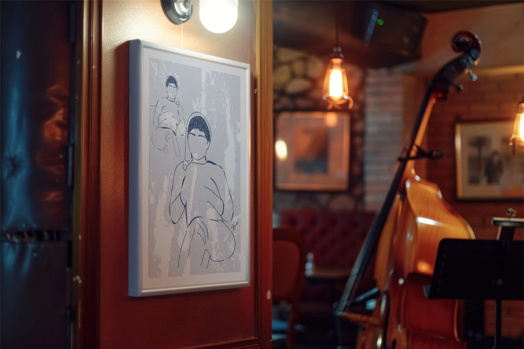 Framed artwork on a wall in a cozy room with musical instruments.