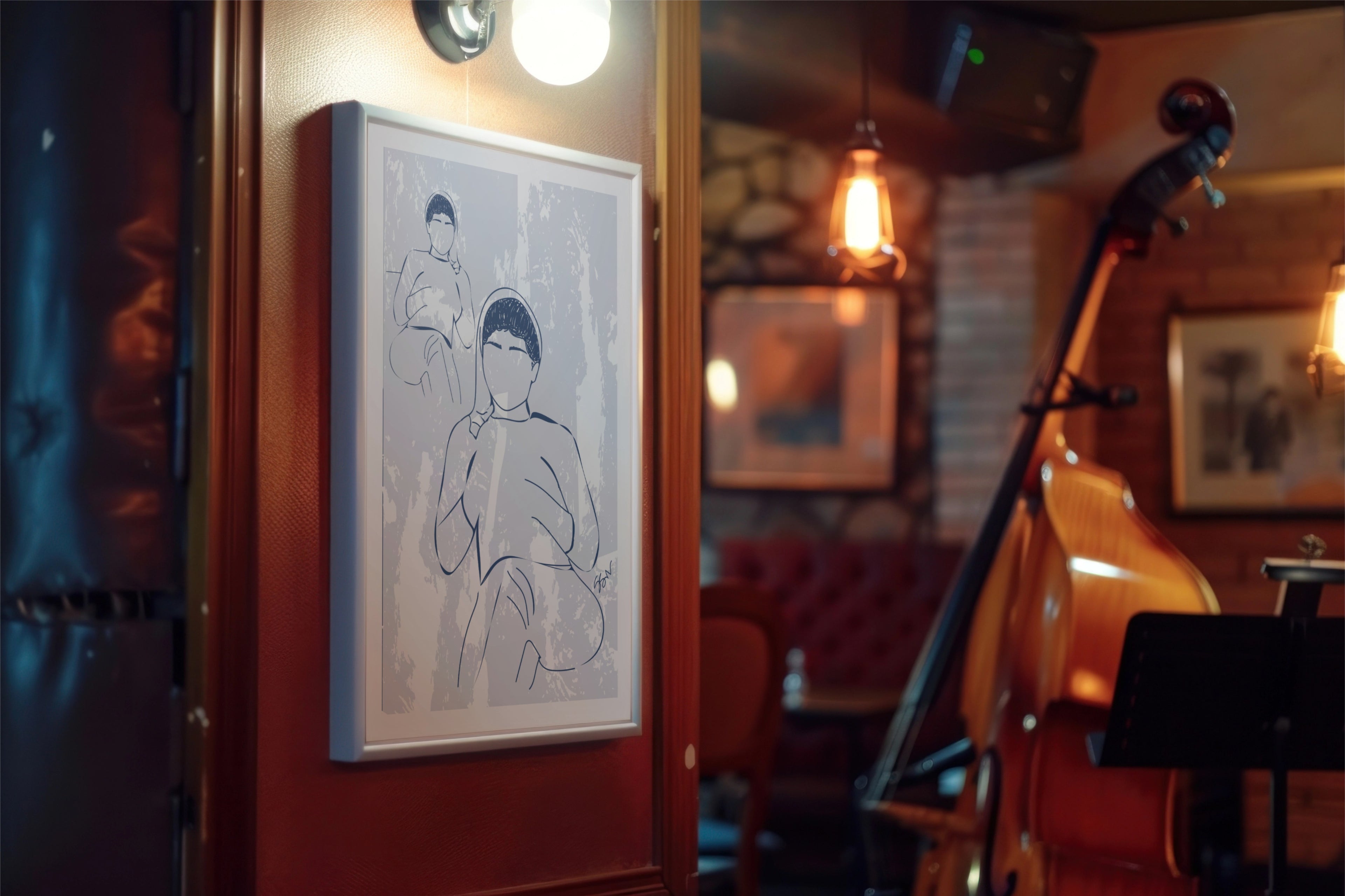 Framed artwork on a wall in a cozy room with musical instruments.