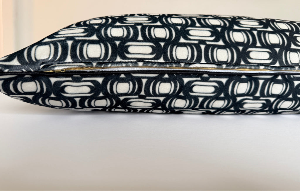 Black and white patterned tray on a light background
