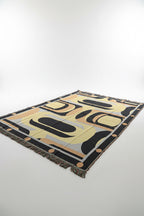 Decorative blanket with geometric pattern on a plain background