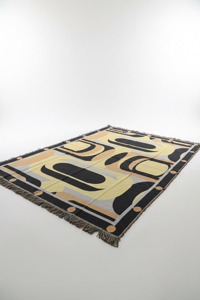 Decorative blanket with geometric pattern on a plain background