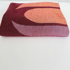Woven textile with abstract design on a white background