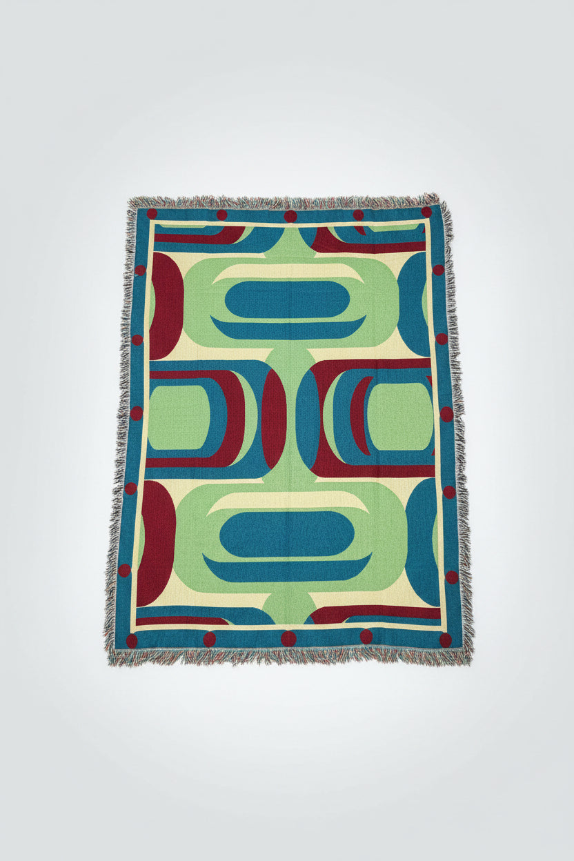 Colorful geometric-patterned blanket on a white background