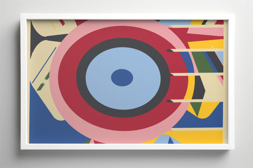 A framed abstract geometric art print featuring concentric circles and bold color blocks in red, blue, yellow, pink, black, and cream, displayed against a neutral gray wall.